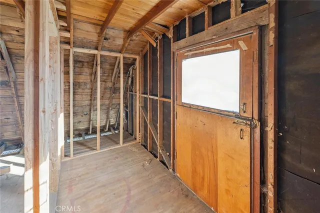 a view of a balcony with wooden floor