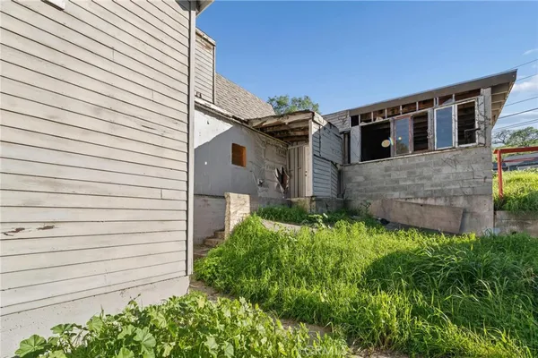 a aerial view of a house with a yard