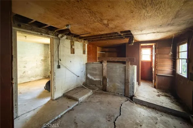 a view of a backyard with wooden fence