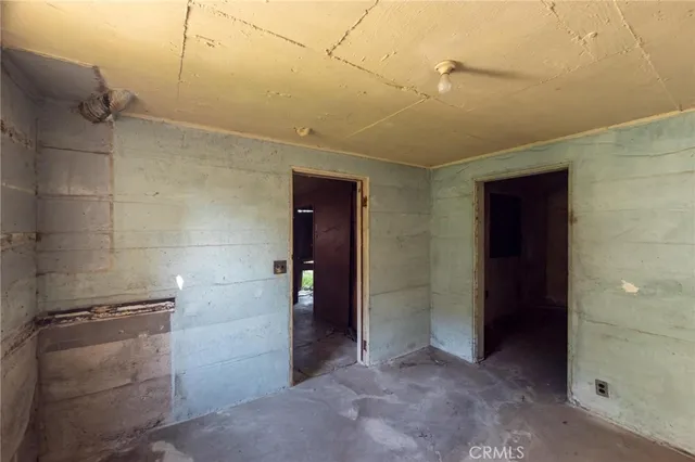 a view of a porch with a table and chairs