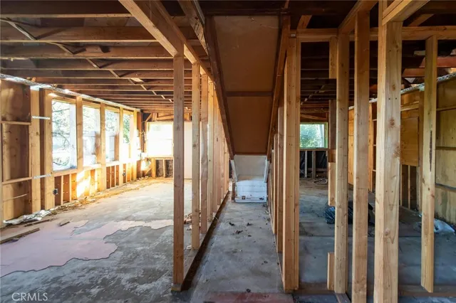 a bathroom with a glass door shower and a sink