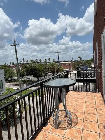 a view of balcony with furniture