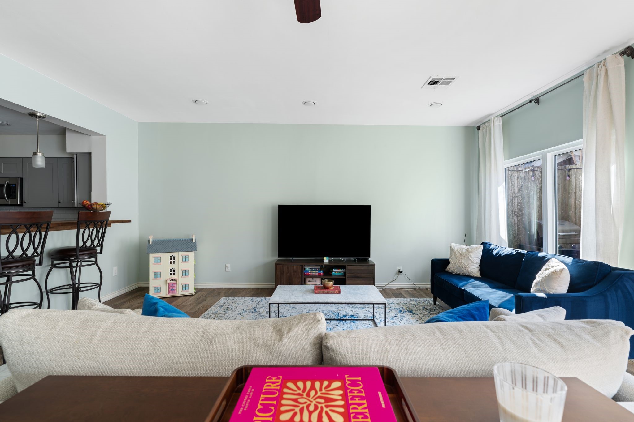 2612 Yupon Street Houston, TX 77006 - Photo 15 of 41 Fresh interior paint, large windows, and bar seating overlook bring natural light and connection between spaces into this inviting first floor living area.