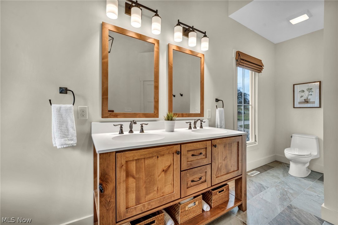 11295 Sutton Place Chardon, OH 44024 - Photo 22 of 50 Bathroom with toilet and double vanity