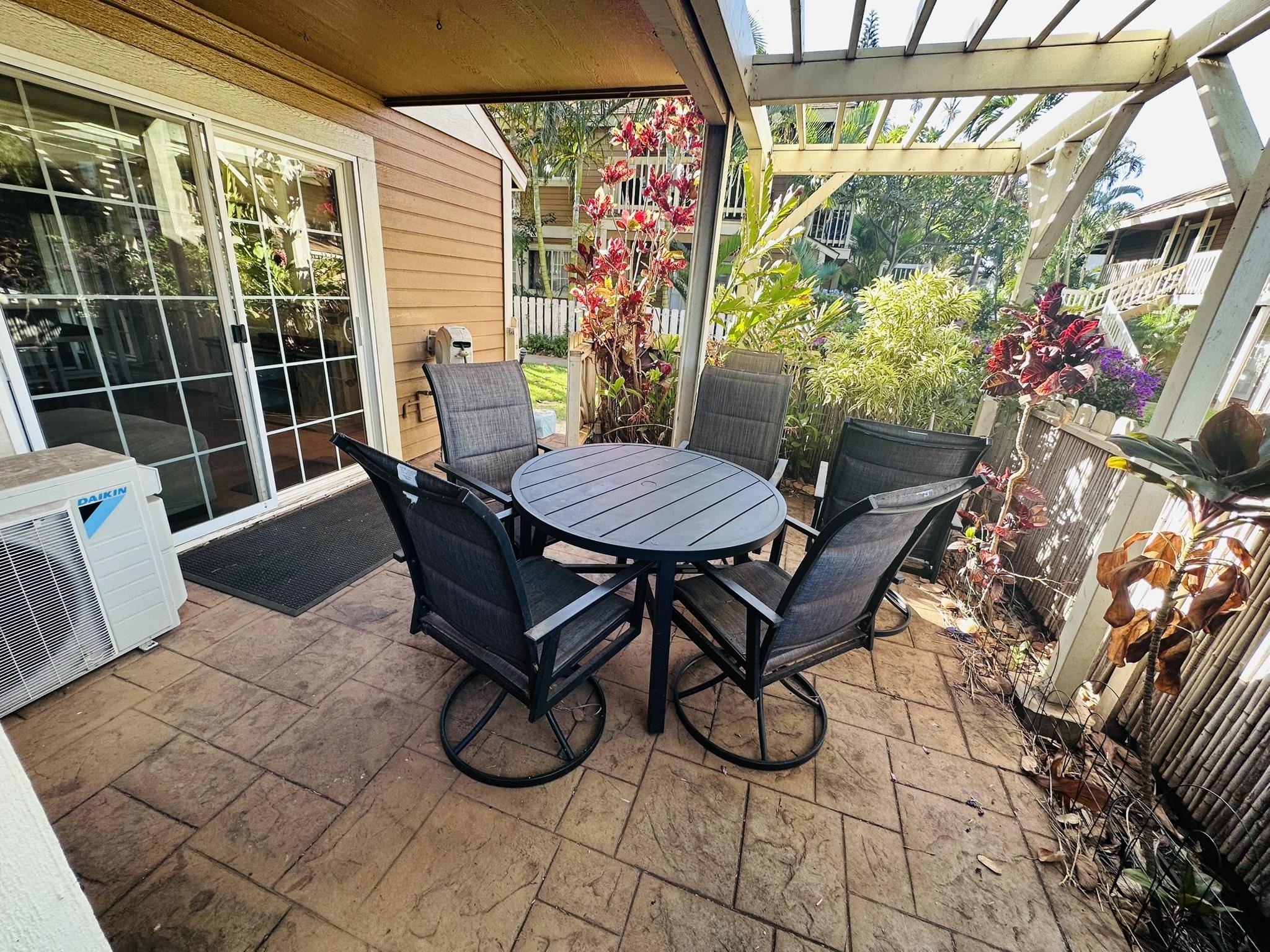140 Uwapo Road, Unit 6101 Kihei, HI 96753 - Photo 2 of 19 a view of a dining room with furniture window and wooden floor