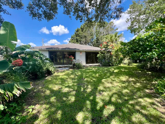a front view of a house with yard