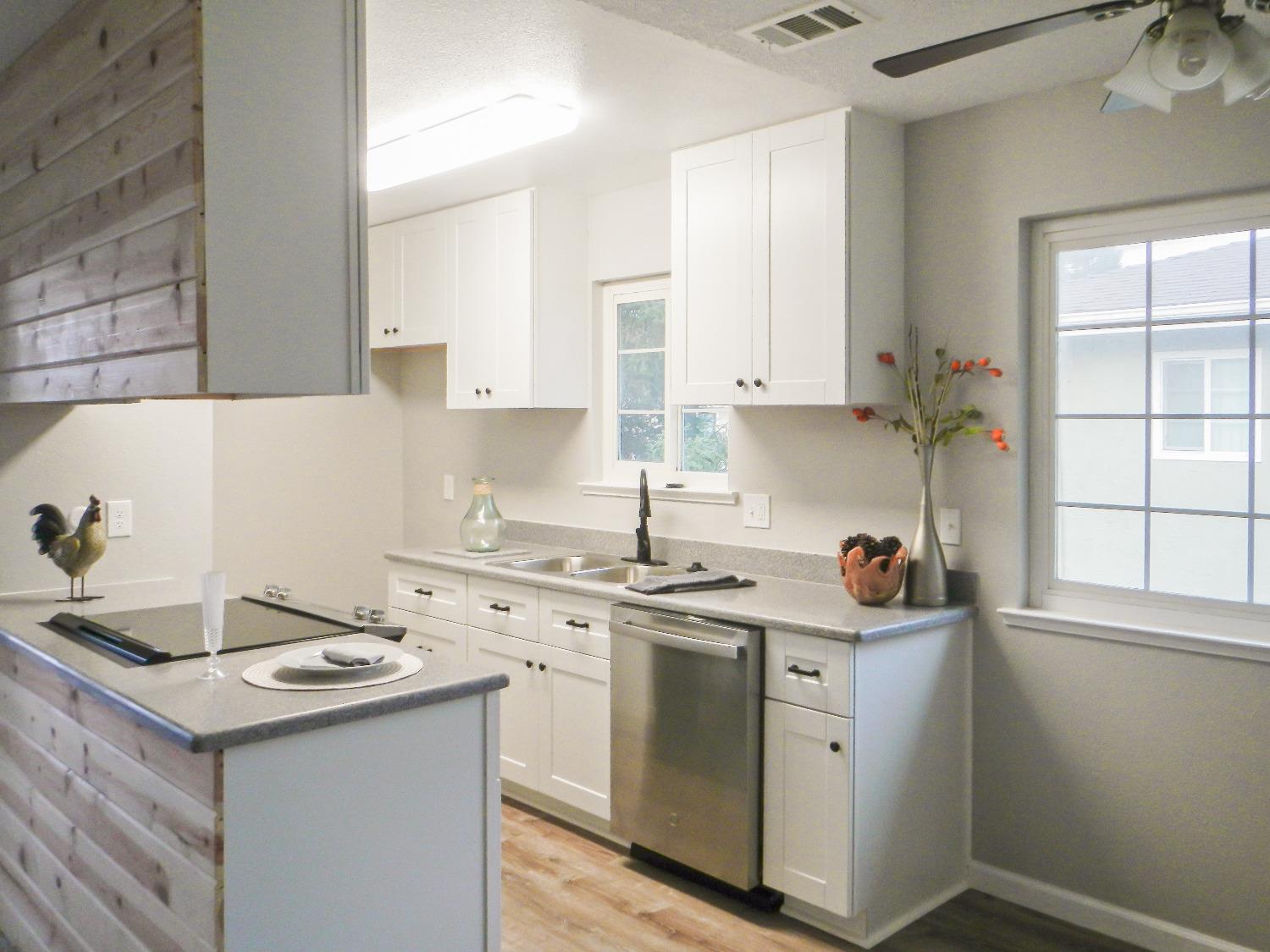 2320 Peach Avenue, Unit 4 Clovis, CA 93612 - Photo 3 of 14 a kitchen with a sink stove and cabinets