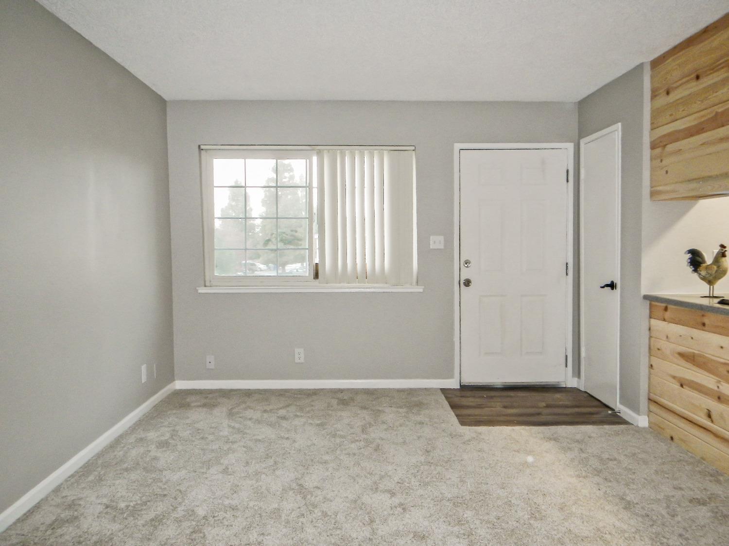 2320 Peach Avenue, Unit 4 Clovis, CA 93612 - Photo 6 of 14 an empty room with windows