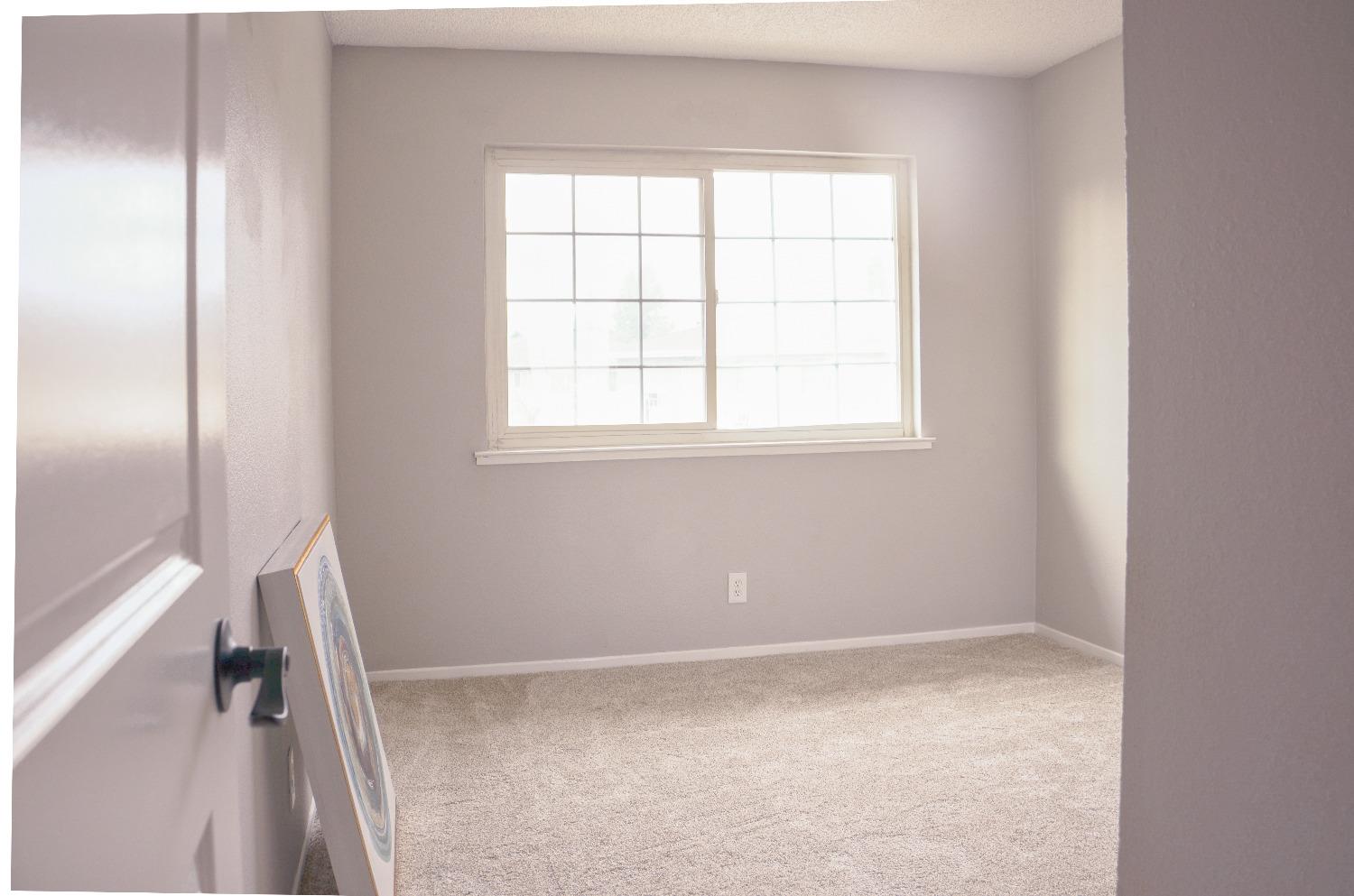2320 Peach Avenue, Unit 4 Clovis, CA 93612 - Photo 7 of 14 an empty room with a window