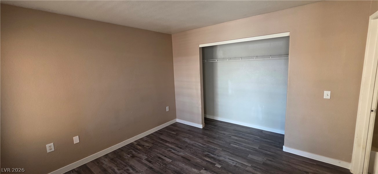 1830 North Pecos Road, Unit 142 Las Vegas, NV 89115 - Photo 16 of 19 Ample closet space complements the durable wood flooring in this inviting room.