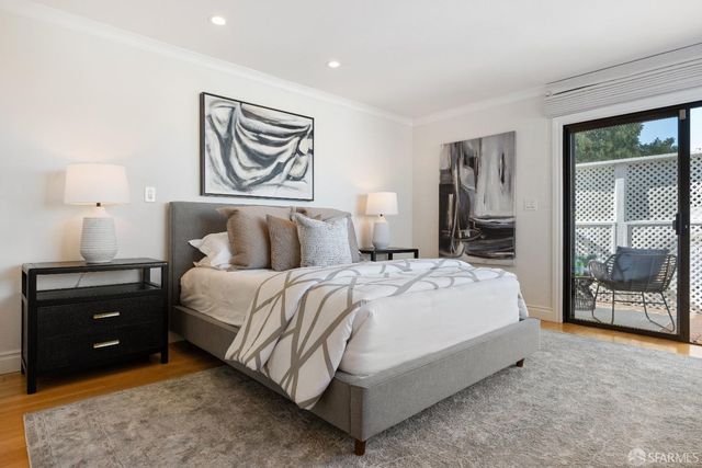 a bedroom with a bed and a cabinets