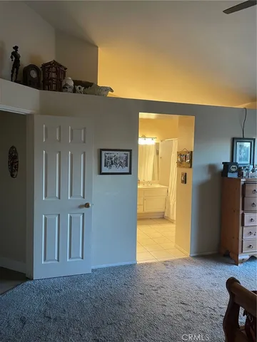 a view of a livingroom with a kitchen