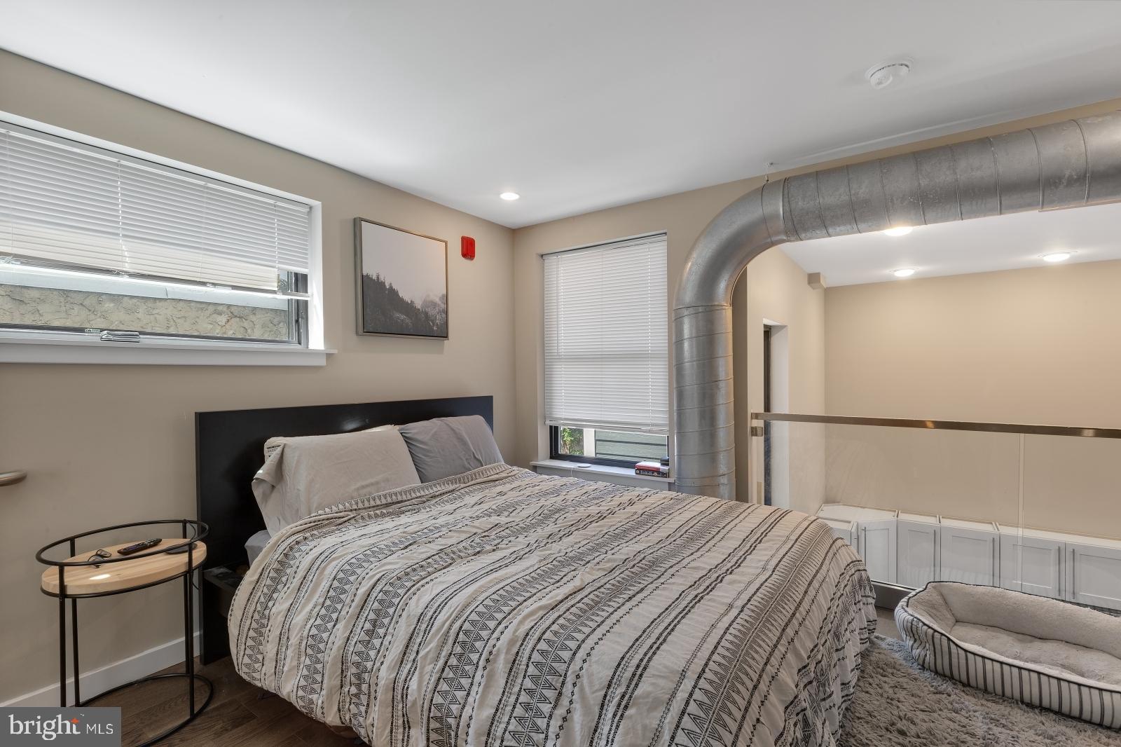 1142 Crease Street, Unit 2L Philadelphia, PA 19125 - Photo 12 of 17 a bedroom with a bed and a couch