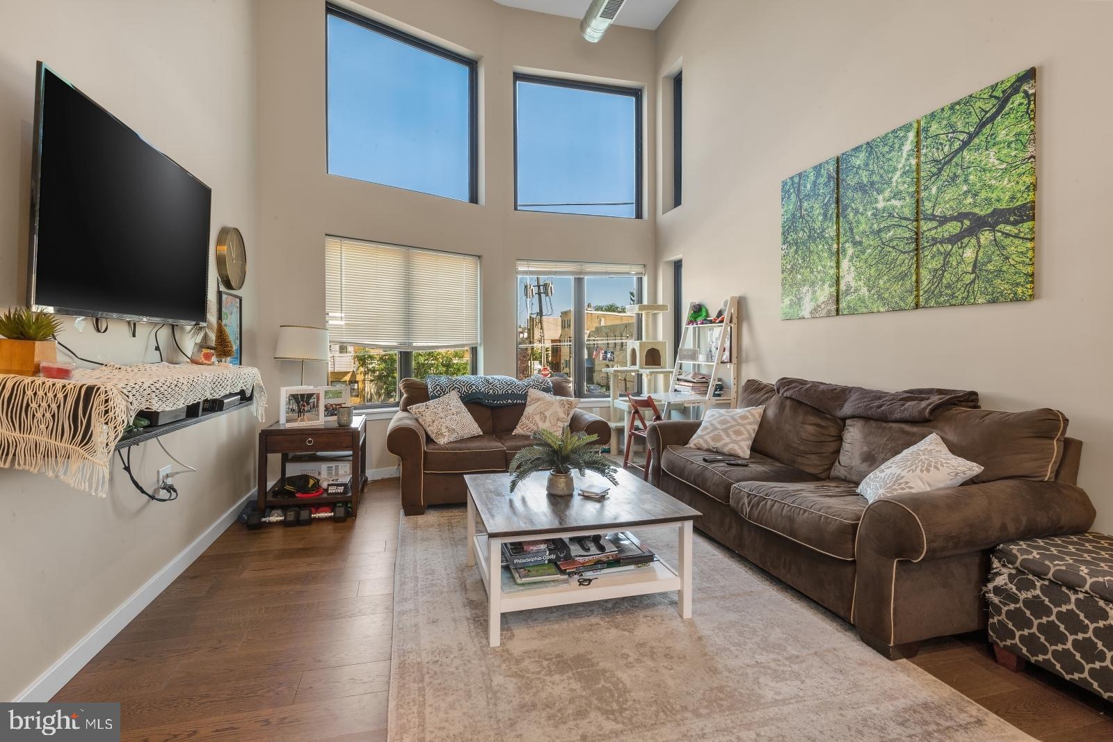 1142 Crease Street, Unit 2L Philadelphia, PA 19125 - Photo 5 of 17 a living room with furniture and a flat screen tv