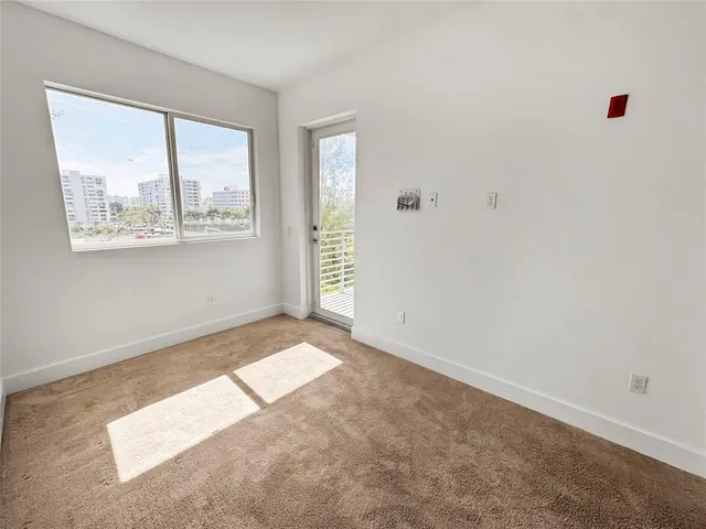 a view of walk in closet with clothes