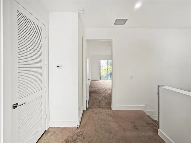 an empty room with closet area