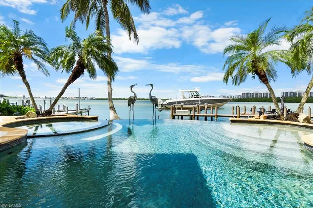 a view of a swimming pool with chairs