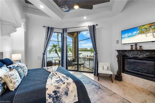 a bedroom with bed and large windows