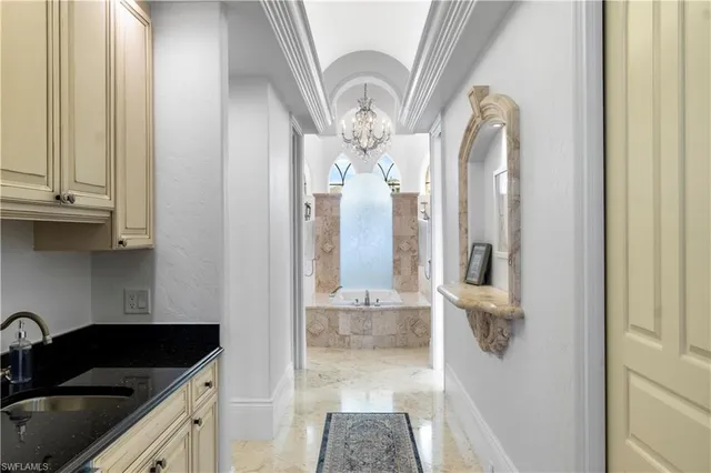 a kitchen with a sink and cabinets