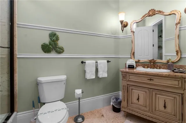 a bathroom with a toilet a sink and bathtub