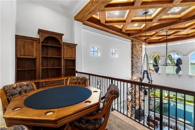 a view of a chairs and table in the balcony