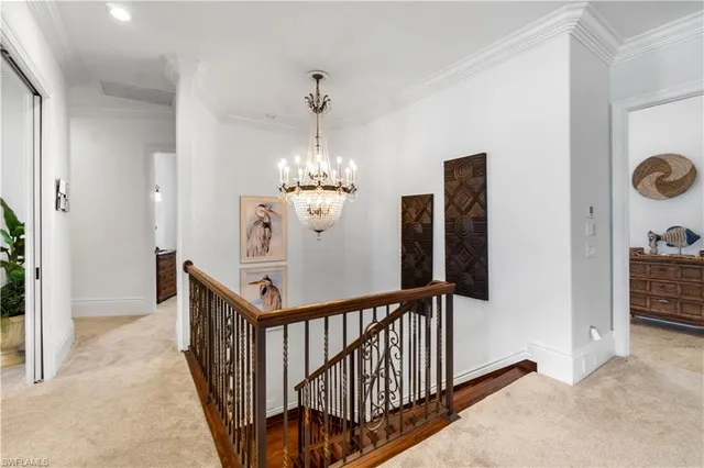 a view of a hallway with a chandelier