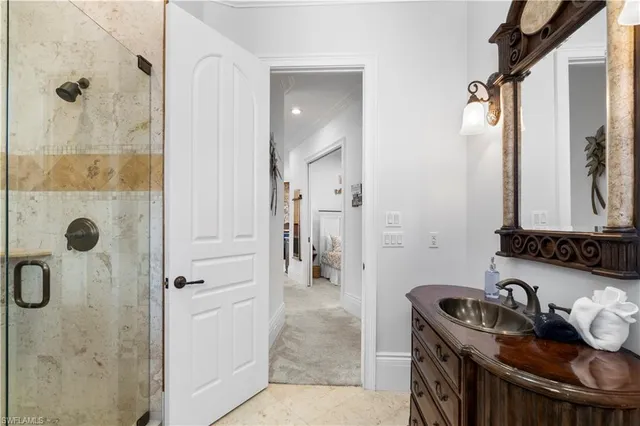 a bathroom with a tub a sink and a mirror