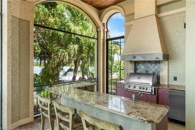 a kitchen with a table chairs and a stove