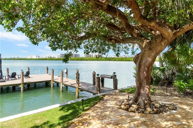a view of a lake with outdoor seating