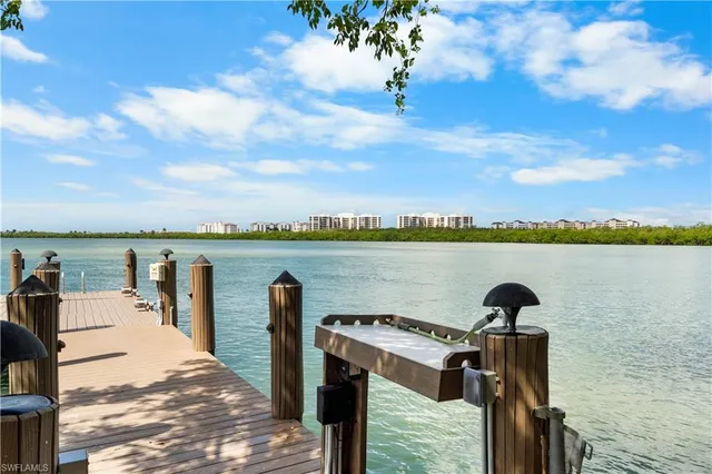 a view of a lake with houses in the back