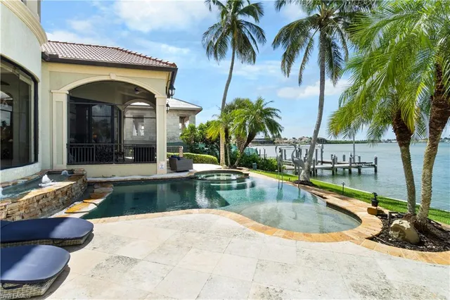 a view of swimming pool with outdoor seating
