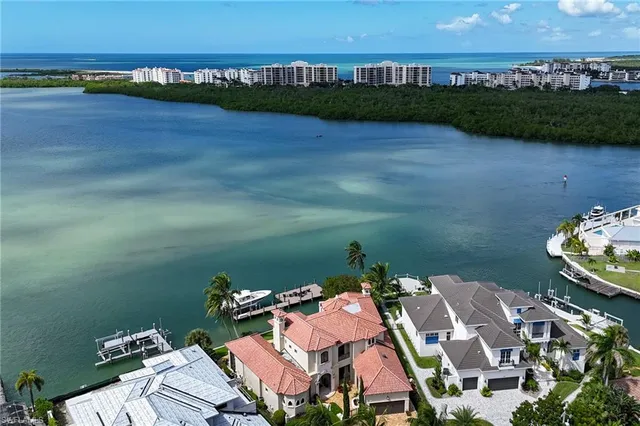 an aerial view of a house with a lake view