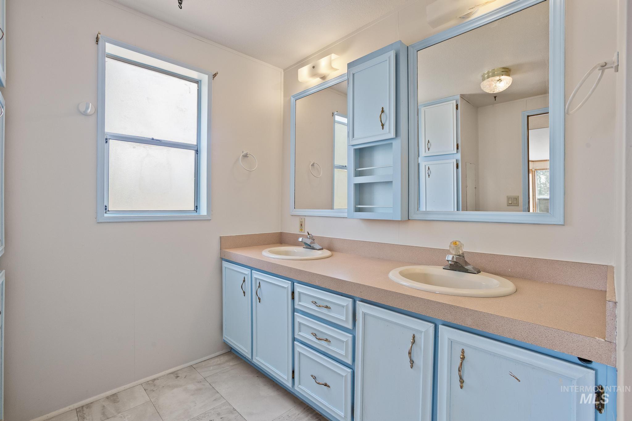 3680 South Mill Road Emmett, ID 83617 - Photo 30 of 38 Dual vanity with integrated sinks set in a light-colored countertop