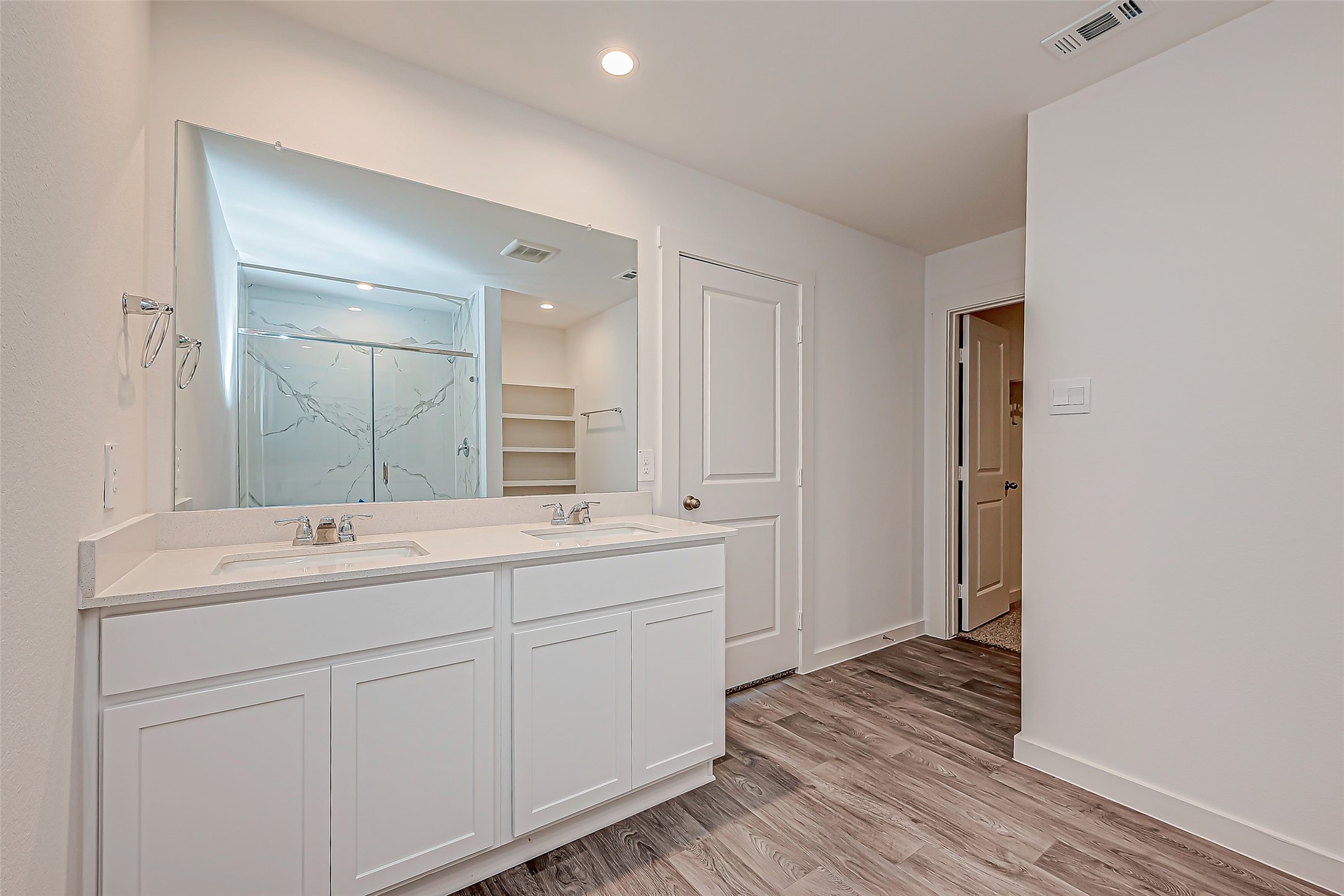 6108 Ryon Falls Drive Rosenberg, TX 77469 - Photo 29 of 39 a bathroom with a double vanity sink and mirror