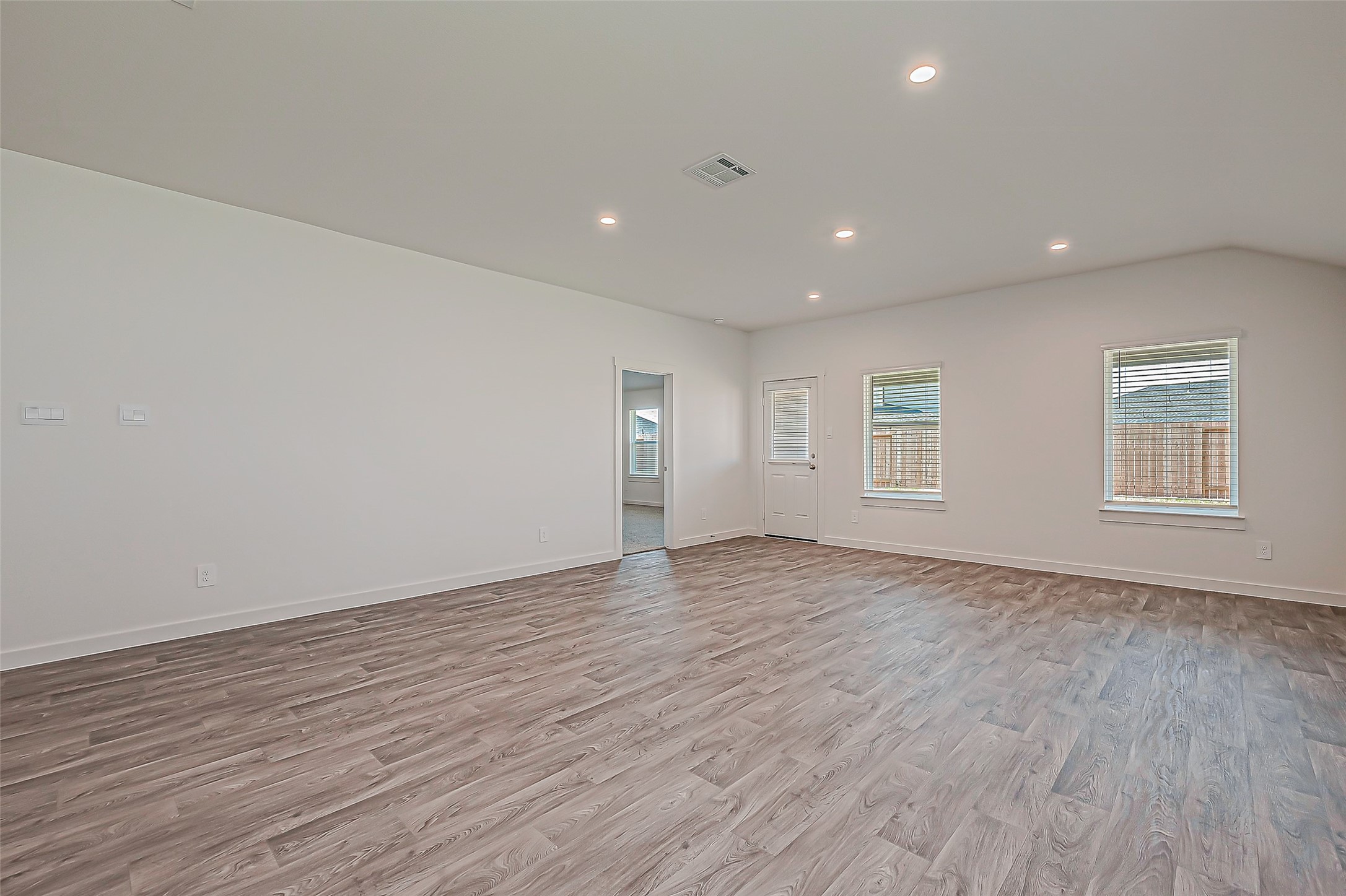 6108 Ryon Falls Drive Rosenberg, TX 77469 - Photo 9 of 39 a view of empty room with wooden floor and fan