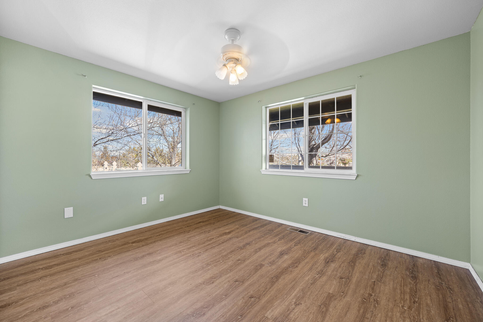 1549 Glacier Ridge Road Bend, OR 97701 - Photo 19 of 27 a view of room with window and wooden floor