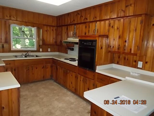 522 Bennett Hill Road Red Boiling Springs, TN 37150 - Photo 11 of 23 a kitchen with stainless steel appliances a sink a stove and a refrigerator
