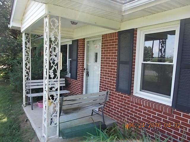 522 Bennett Hill Road Red Boiling Springs, TN 37150 - Photo 15 of 23 front view of a house with a porch