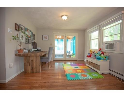 6 North Martin Road Amesbury, MA 01913 - Photo 11 of 29 a living room with furniture and a flat screen tv