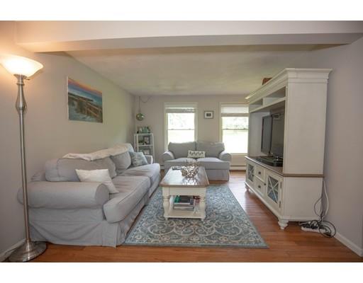 6 North Martin Road Amesbury, MA 01913 - Photo 13 of 29 a living room with furniture and a flat screen tv