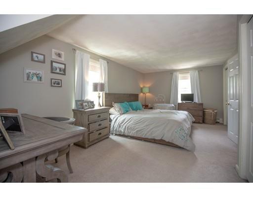 6 North Martin Road Amesbury, MA 01913 - Photo 16 of 29 a bedroom with a bed and a table