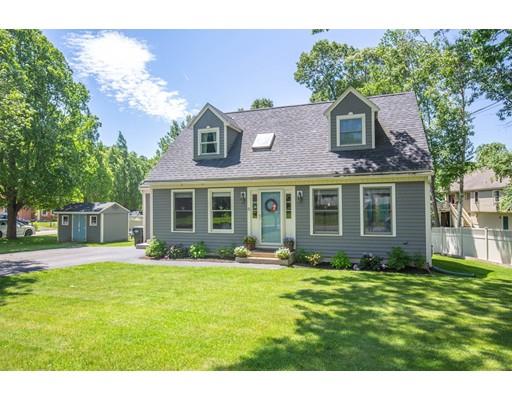 6 North Martin Road Amesbury, MA 01913 - Photo 2 of 29 a front view of a house with a yard and trees