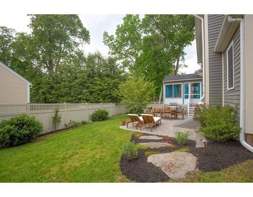 6 North Martin Road Amesbury, MA 01913 - Photo 27 of 29 a view of backyard of house with outdoor seating and green bushes