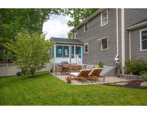 6 North Martin Road Amesbury, MA 01913 - Photo 28 of 29 a backyard of a house with table and chairs