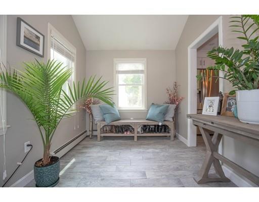 6 North Martin Road Amesbury, MA 01913 - Photo 3 of 29 a living room with furniture and a potted plant