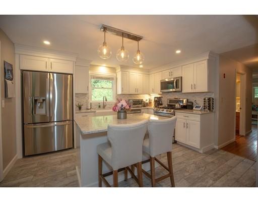 6 North Martin Road Amesbury, MA 01913 - Photo 9 of 29 a kitchen with refrigerator and cabinets