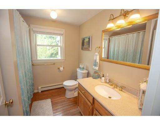 6 North Martin Road Amesbury, MA 01913 - Photo 10 of 29 a bathroom with a sink and a mirror