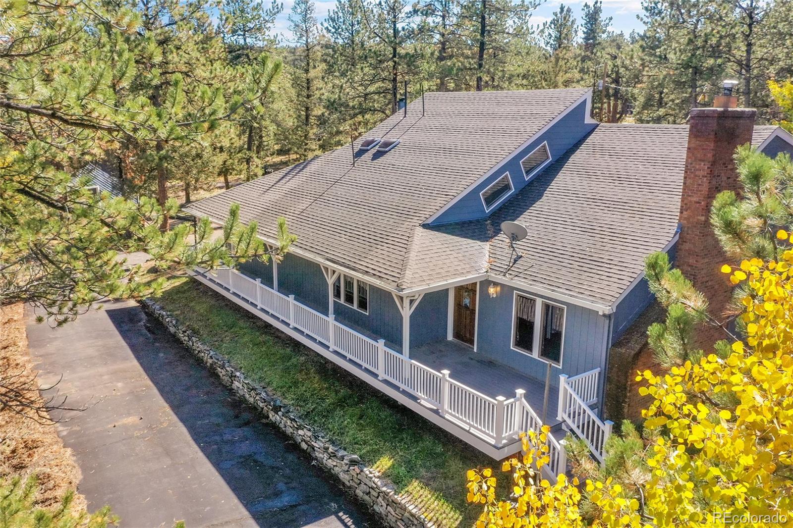 a aerial view of a house with a yard
