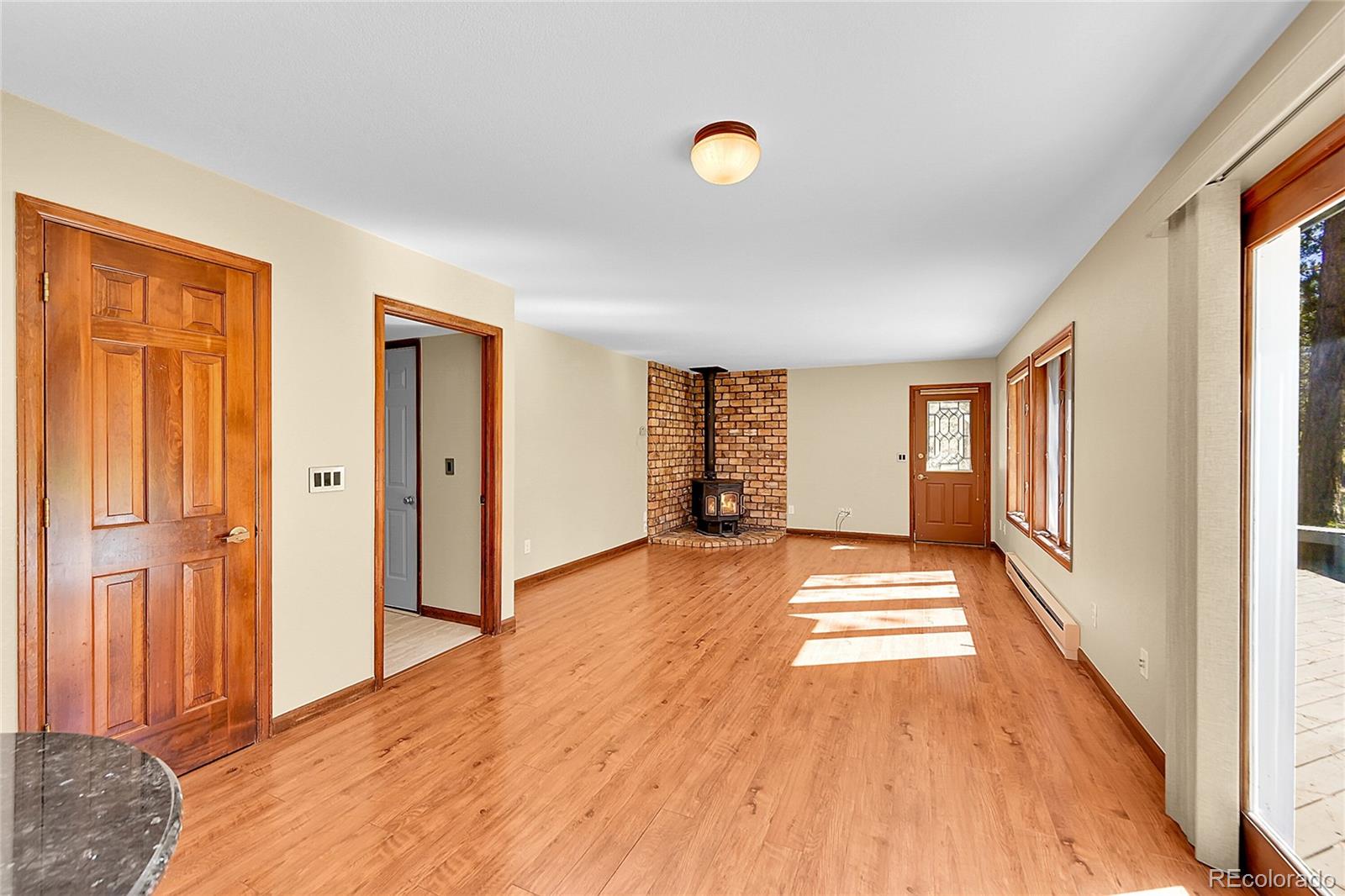 348 Nova Road Pine, CO 80470 - Photo 17 of 50 a view of a livingroom with wooden floor and a window