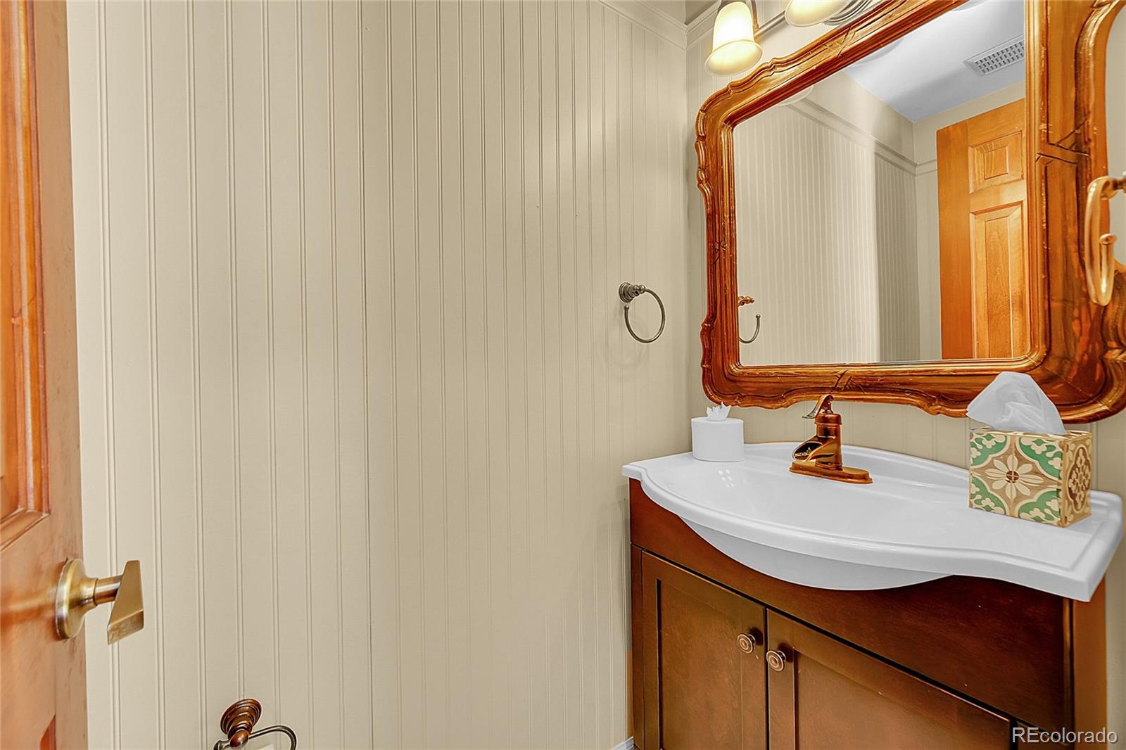 348 Nova Road Pine, CO 80470 - Photo 18 of 50 a bathroom with a sink and a mirror